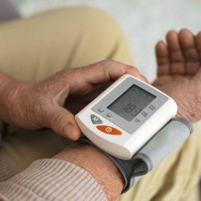 older-person-checking-their-blood-pressure-with-tensiometer